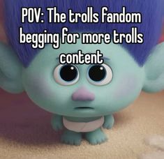 a troll with blue hair and big eyes is looking at the camera text pov the trolls fandom begging for more troll's content