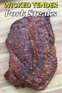 a close up of a steak on a cutting board with the words pork steaks