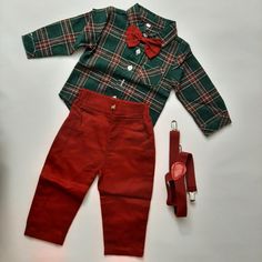 Dress up your little one in this adorable Moyikiss Studio 3-piece outfit set. The set includes a red and green plaid shirt, green suspenders, and matching green pants. Perfect for any occasion, this outfit is versatile and stylish. The shirt features a classic button-up design while the pants have an elastic waistband for a comfortable fit. It's ideal for babies and toddlers, aged 6-12 months, and is suitable for both boys and girls. Add this charming set to your child's wardrobe today! Fitted Green School Sets, Fitted Green Sets For School, Cotton School Sets For Fall, Green Cotton School Sets, Green Suspenders, Green Plaid Shirt, Green Pants, Pant Shirt, Green Plaid