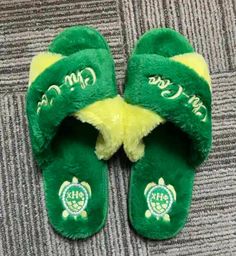 FUZZY CHI SLIPPERS!   These fuzzy house slippers are sure to  keep your toes warm and relaxed after a long day in the unit. Every nurse needs comfort and luxury.  These slippers offer comfort durability and would pair well with your chi eta phi pajamas!  Represent our organization and pair with your chi pajamas  at your  university's org pajama parties or in the comfort of your home. 🐢 💛💚 🐢 colors green and yellow 🐢 Shipped in TT&Co bag   🐢 Washing Instructions: -  not recommended.  🐢 3 s Comfortable Green Slide Slippers, Green Non-slip Slippers For Leisure, Comfortable Green Indoor Slippers, Comfortable Soft Indoor Slippers, Comfortable Green Flat Flip Flops, Green Comfortable Flat Flip Flops, Comfy Super Soft Slippers For Home, Comfortable Soft Slippers For Home, Comfortable Non-slip Home Slippers