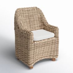 a wicker chair with a white cushion