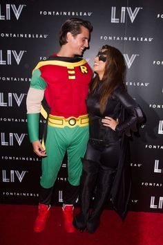 a man and woman dressed up in costumes