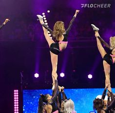 the cheerleaders are performing their routine on stage