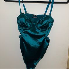 Never Worn, Too Small For Me. Dark Green Satin Cutout Bodysuit - Perfect For A Night Out! Purchased From Urban Outfitters. Green Fitted One-piece Bodysuit, Fitted Green One-piece Bodysuit, Green One-piece Bodysuit With Lined Body, Fitted Green Bodysuit For Night Out, Green One-piece Bodysuit For Party, Green One-piece Party Bodysuit, Green Lined Bodysuit, Green Sleeveless Bodysuit For Night Out, Urban Outfitters Fitted One-piece Swimwear