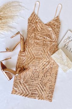 Shine bright in our Make Your Entrance Rose Gold Sequin Tie-Back Mini Dress! This show-stopping cocktail dress features an array of sparkling rose gold sequins and two long chiffon straps to create a stunning back detail Gold Strapless Dress For Spring Evening, Gold Strapless Dress For Evening In Spring, Chic Strapless Sequin Dress For Holiday, Chic Gold Strapless Dress For Night Out, Gold Strapless Dress For Date Night, Summer Strapless Sequin Midi Dress, Summer Strapless Midi Dress With Sequins, Gold Strapless Dress For Night Out Party Season, Gold Strapless Dress For Party Season