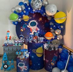 a space themed birthday party with balloons and decorations