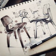 a drawing of two chairs and a table with a pen on it next to a notebook