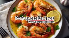 a white plate topped with shrimp and lemon