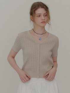 This is a modern and feminine cardigan by PLAC that is made out of high quality and sturdy fabric. With unique design detail and trendy mood, you can style it for your casual and young daily outfit.- Slim silhouette with short sleeves- Punched detail on the fabric- High air permeability suitable for summer Short Sleeve Knit Cardigan, Chic Short Sleeve Winter Cardigan, Chic Beige Short Sleeve Knit Top, Feminine Cardigan, Elegant V-neck Textured Knit Cardigan, Crochet Short Sleeve, Beige Textured Knit V-neck Cardigan, Crochet Short, Beige Cardigan