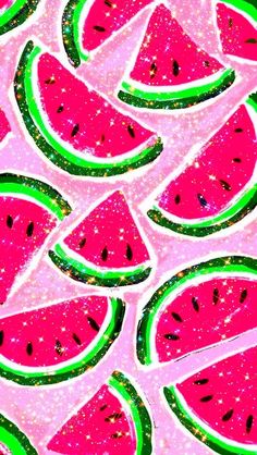 watermelon slices on pink glittered paper with green and black sparkles in the background