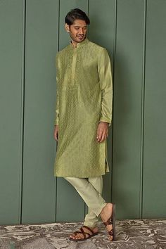 Olive green chanderi kurta with all over floral jaal pattern and tonal resham embroidery. Paired with contrast pyjama. - Aza Fashions Semi-stitched Green Chanderi Sherwani, Green Semi-stitched Chanderi Sherwani, Designer Green Jamawar Churidar, Green Chanderi Sherwani Straight Kurta, Green Chanderi Sherwani With Traditional Drape, Green Cotton Silk Sherwani With Zari Work, Green Chanderi Sherwani For Eid, Traditional Green Kurta With Self Design, Unstitched Green Jamawar Kurta