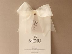 the menu card has a white bow on it