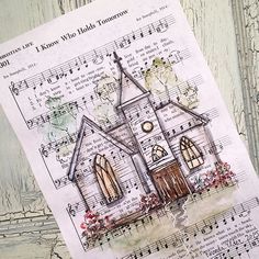 a paper with an image of a church on it and music notes in front of it