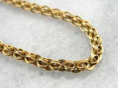 This exceptionally long vintage gold chain has a warm, textured sheen! It's intricately woven knots cascade beautifully down the neck and the smooth links feel great against the skin! This is a beautiful piece to wear alone or it could be combined with a pendant to transform into an outstanding statement piece! Metal: 14 Karat Yellow Gold  Length of Chain: 15 inches long Vintage Gold Chain, Woven Chain, Jewelry Boards, Money And Happiness, Ancient Jewelry, Jewelry Lookbook, I Love Jewelry, Emerald Cut Diamonds, Hand Engraving