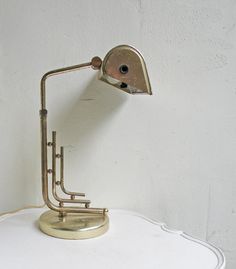 a desk lamp sitting on top of a white table