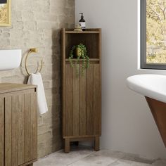 a bathroom with a wooden cabinet next to a bathtub