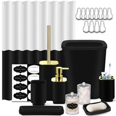 black and white bathroom accessories including soap dispenser, toothbrush holder, toilet paper roll, cup holders and shower curtain