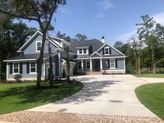 a large blue house with lots of windows