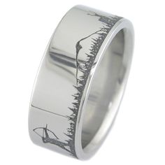 a white gold wedding ring with an etched design