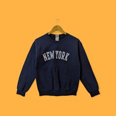 New York city spell out sweatshirt New York city crewneck New York sweater pullover streetwear sports style dark blue colour size small by YoungmodernCo on Etsy Navy Letter Print Sweater For Winter, Urban Sweatshirt With Lettering, Long Sleeve, Crew Sweater With Lettering For Streetwear, Varsity Sweater With Letter Print For Streetwear, Blue Varsity Sweater For Streetwear, Varsity Letter Print Sweater For Streetwear, Crew Neck Sweater With Lettering For Streetwear, Urban Style Long Sleeve Sweatshirt With Lettering, Navy Sweatshirt For Winter Streetwear