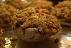 a stuffed animal made out of food sitting on top of a metal table next to other cookies