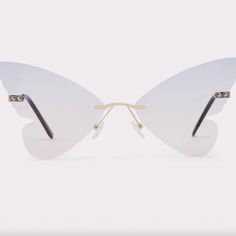 Get Noticed With This Unique Pair Of Butterfly-Shaped Women’s Sunglasses. Frame-Free Gradient Lenses Transition From Soft Pink To Light Blue With Gold-Tone Arms And Bridge, Grounding The Look. Tone Arms, Aldo Accessories, Toned Arms, Sunglasses Frame, Butterfly Sunglasses, Colored Sunglasses, Soft Pink, Sunglasses Accessories, Lenses