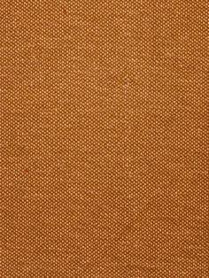 an orange fabric textured with small dots on the outside, and brown in the inside