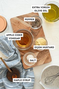 ingredients to make an apple cider recipe laid out on a cutting board with labels