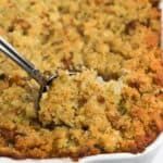 a close up of a casserole dish with a fork sticking out of it