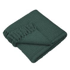 a green blanket folded on top of a white background