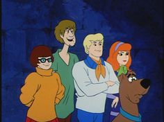 the scooby gang is standing in front of a blue background with an orange dog