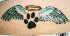 a dog paw with an angel wing tattoo on it