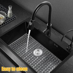 a kitchen sink that is clean and ready to be used in the home or office