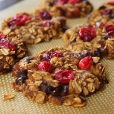 granola cookies with cranberries and cherries on a baking tray ready to be eaten