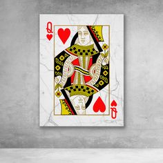 the queen of hearts playing card is displayed on a white wall with red and yellow accents