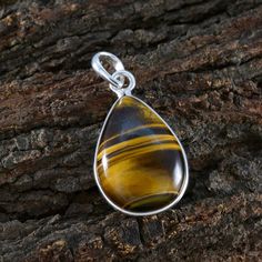 Riyo Knockout Gemstones Pear Cabochon Brown Tiger Eye Sterling Silver Pendants Jewelry In Greenville Tiger Eye Brown Good Gemstones Bezel Setting Pendant- 925 Sterling Silver Brown Tiger Eye Pendant - Tiger Eye Pendant, Sterling Silver Pendant, Brown Tiger Eye Pendant, Great Jewelry, Gemstones Pendants, Handmade Gift, #TigerEyeSilverPendant #HandcraftedTigerEyeCharm #ArtisanTigerEyeNecklace #UniqueGemstoneJewelry #SterlingSilverTigerEye Handmade Pendants