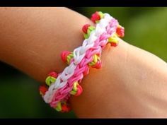 a person wearing a colorful bracelet on their arm