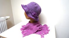 Beautiful hand crochet purple fedora / cloche / hat / beret / beanie / skullcap with lovely ruffle brim with variegated (melange) fringed scarf.  It is not original set, but items fit nicely together. Made of wool blend yarn. Hat is decorated with romantic rope flower and strap. Non itchy. Fits most adult and teen sizes -  stretchable. SIZE. The height of hat is 8.5'' (21.5 cm) brim including. Scarf is 9"(23 cm) wide and 70" (99 cm) long. Ready to ship.  Care: If needed, use delicate handwash wi Hand Knitted Adjustable Cloche Hat For Winter, Adjustable Hand Knitted Cloche Hat For Winter, Adjustable Hand-knitted Winter Cloche Hat, Handmade Brimmed Cloche Hat For Winter, Pink Crochet Hat With Short Brim For Winter, Adjustable Purple Crochet Hat For Winter, Casual Purple Brimmed Crochet Hat, Casual Hand Knitted Winter Cloche Hat, One Size Purple Crochet Hat For Spring