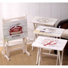 three chairs and tables with signs on them in a room next to a chair that has the words crab's oysters written on it