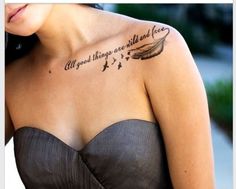 a woman with a tattoo on her chest that says, all good things are wild and free