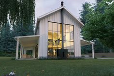 a rendering of a modern house in the middle of a grassy area with trees and grass