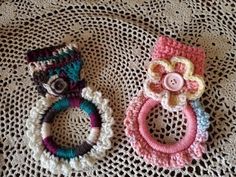 two crocheted hair rings on top of a doily