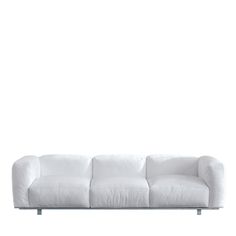 a white couch sitting on top of a metal frame