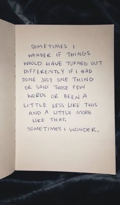 an open book with writing on it and someone's handwritten poem in blue ink