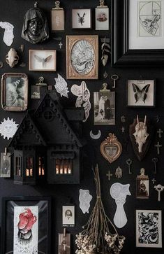 a black wall covered in pictures and other items