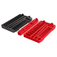 two red and black plastic trays with holes