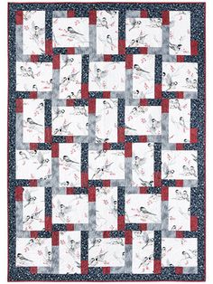 a quilt with red and white squares on it