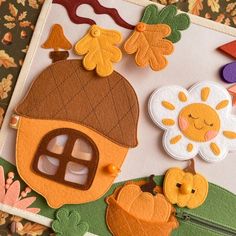 an image of felt crafting with flowers and houses