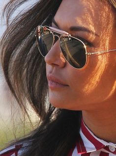 a close up of a person wearing sunglasses