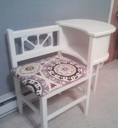 a white chair with a patterned seat cushion